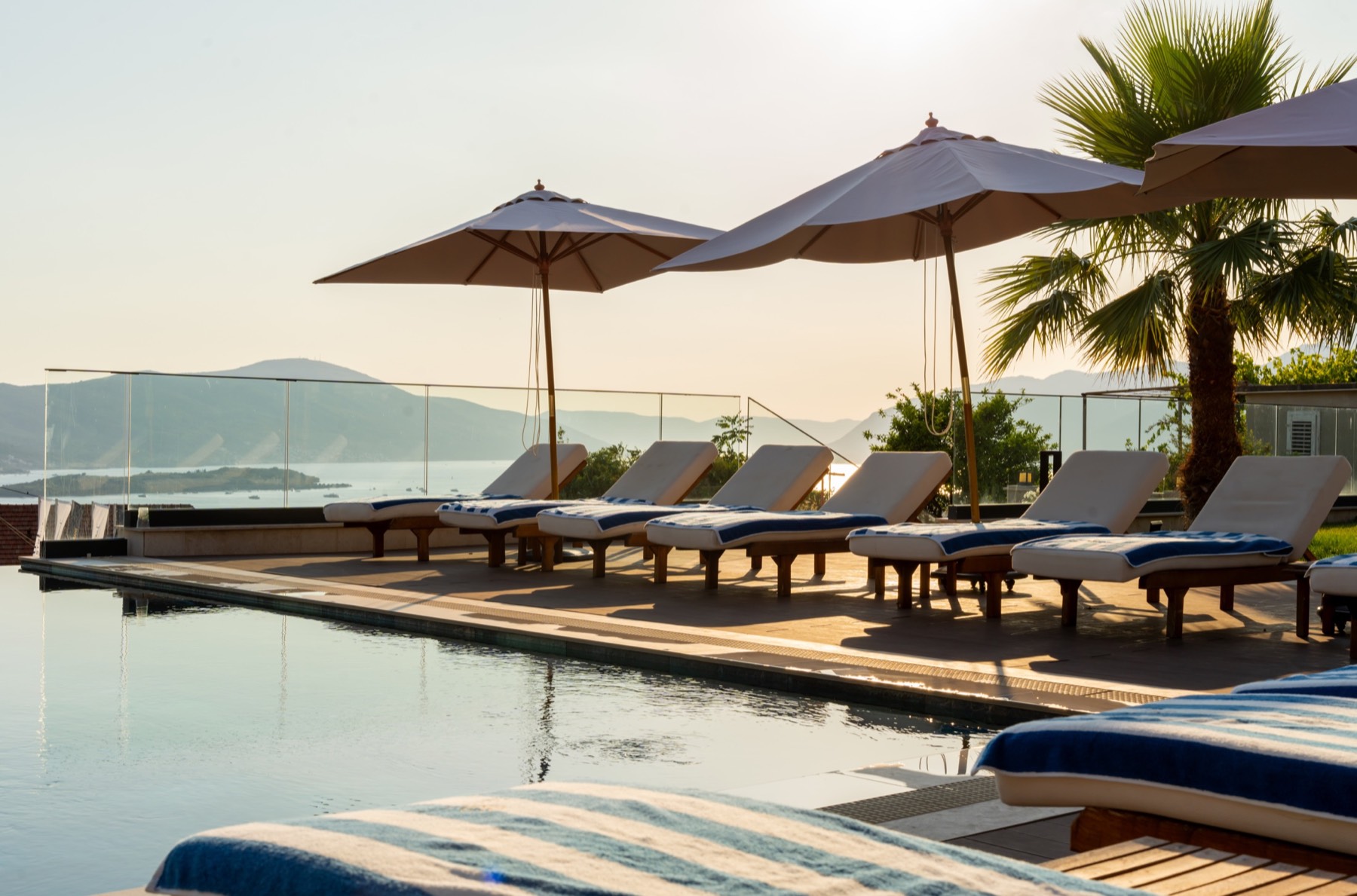 The Royal Blue outdoor pool overlooking the Bay of Kotor at sunset